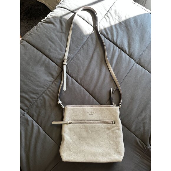 kate spade Handbags - Kate Spade gray crossbody bag - small defects on back